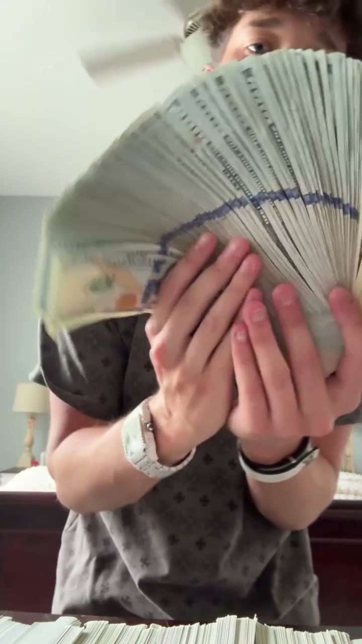 Frame of the bills spread into a fan in front of the character