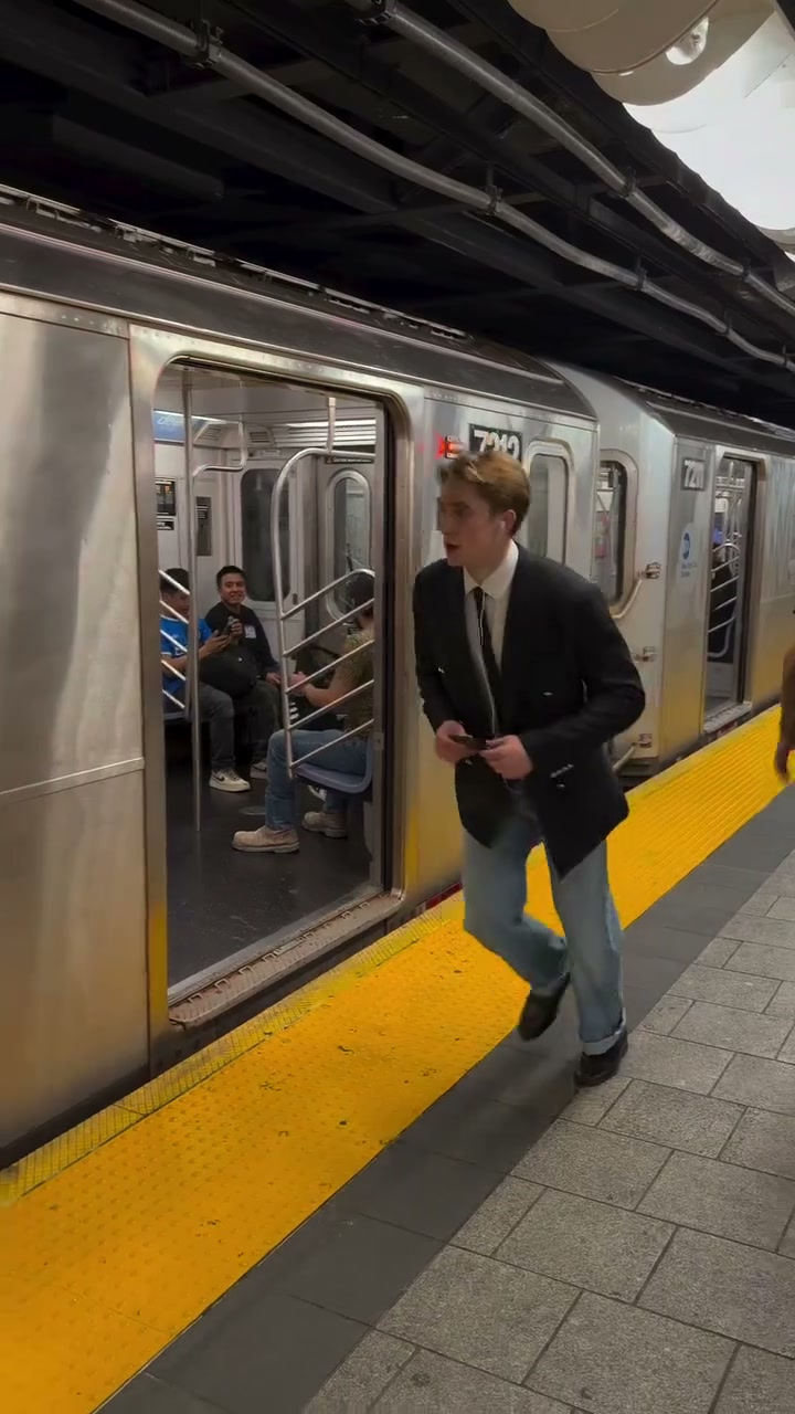 Frame showing the character’s outfit beside the train